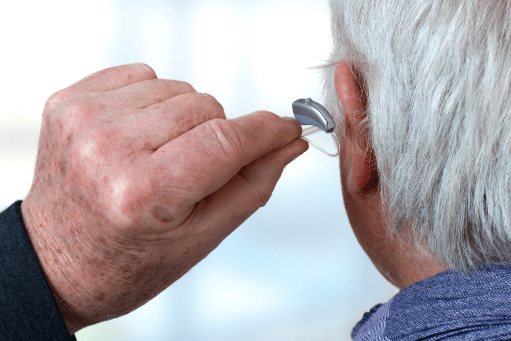 Cheap hearing aids for elderly people helping senior couple hear clearly at home